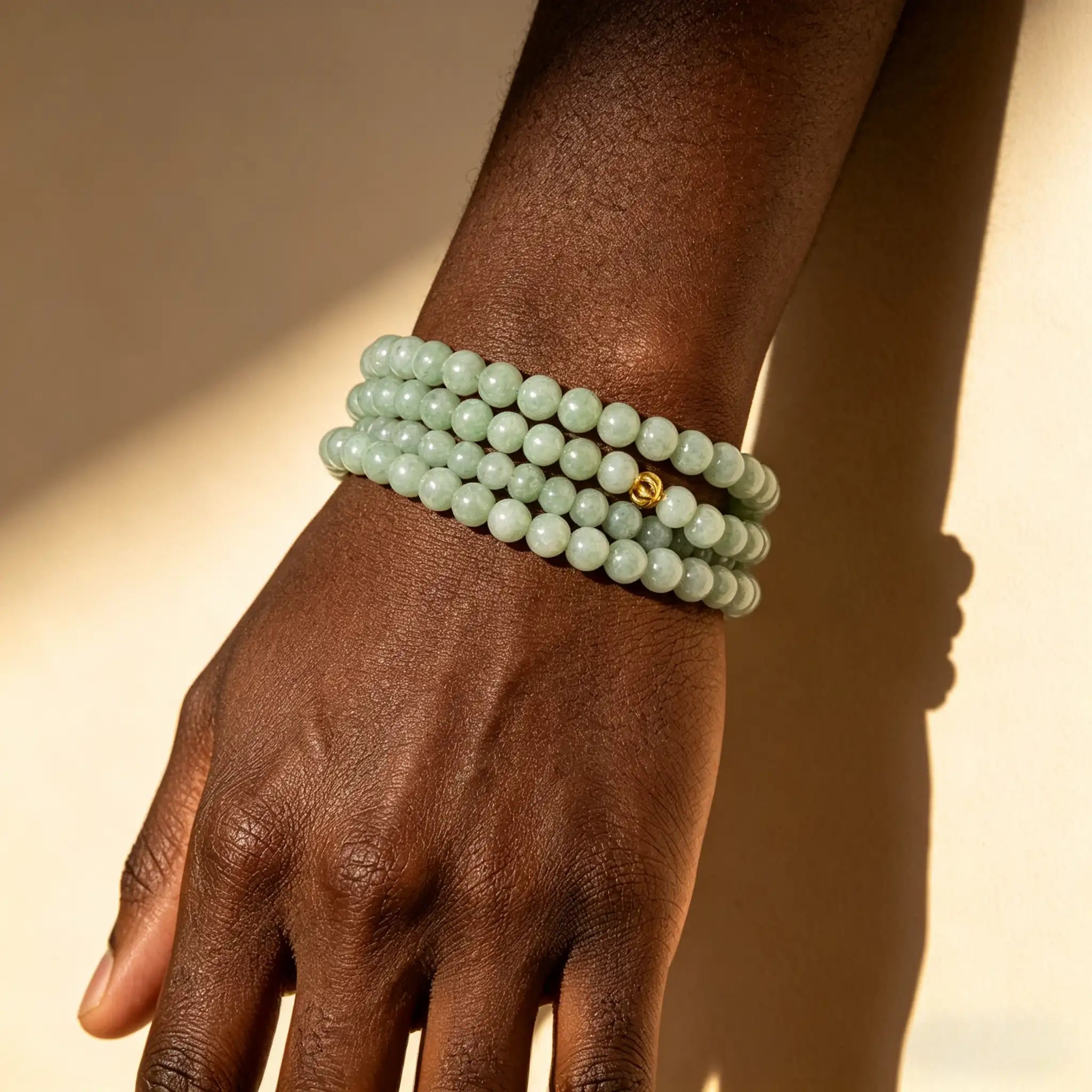 108 Natural Jade Bead Luck Mala Necklace worn as a green jade mala bracelet on the wrist