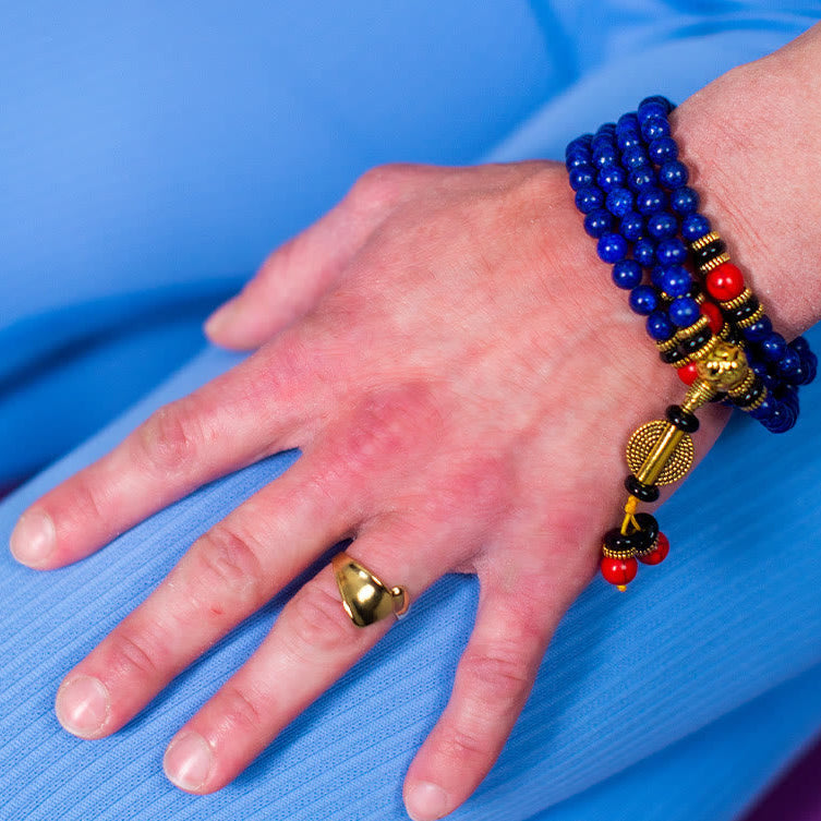 Macro shot of Lazurite gemstone and brass divider beads – TheFuMaster