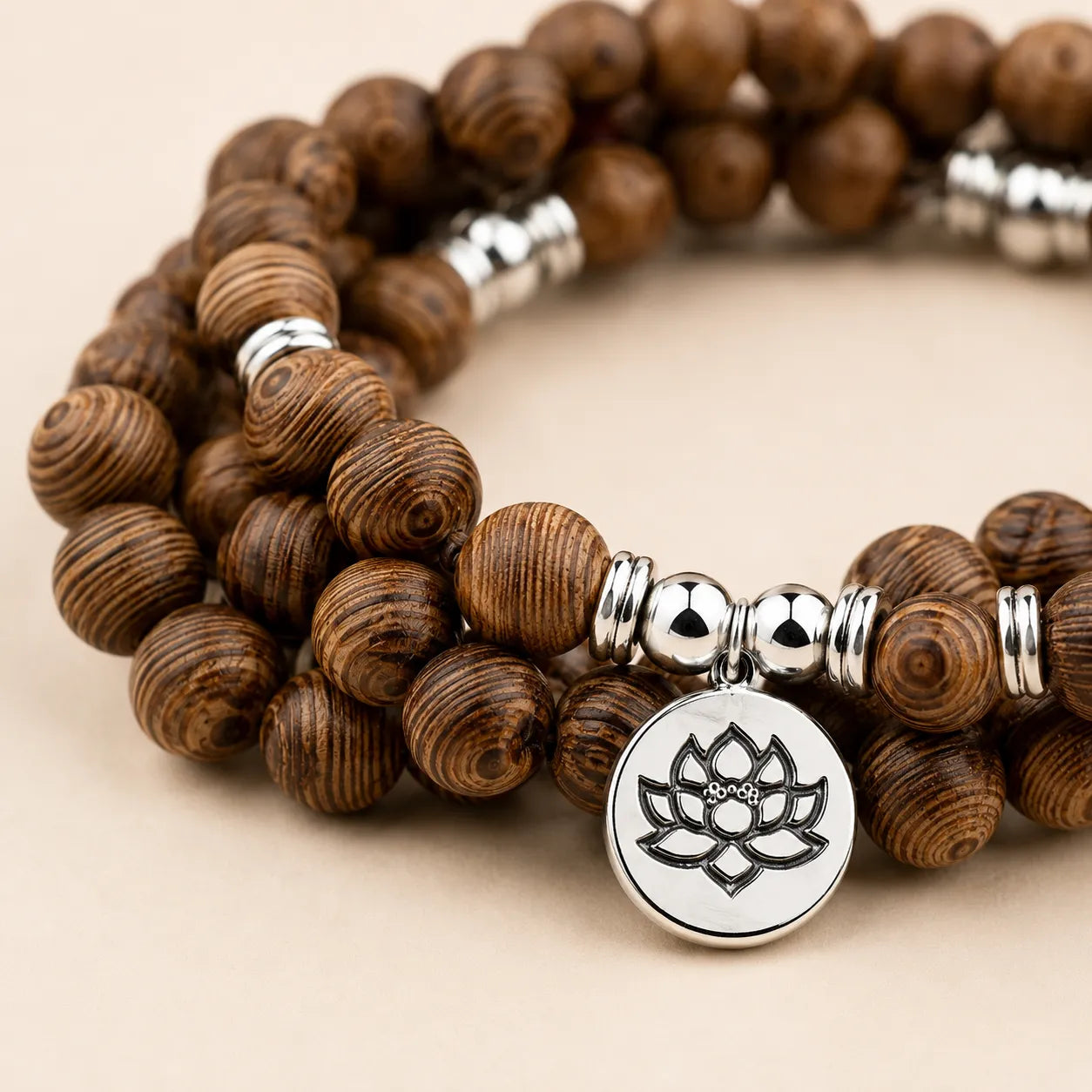 Lotus Wood Bead Mala Bracelet shown from another angle with lotus