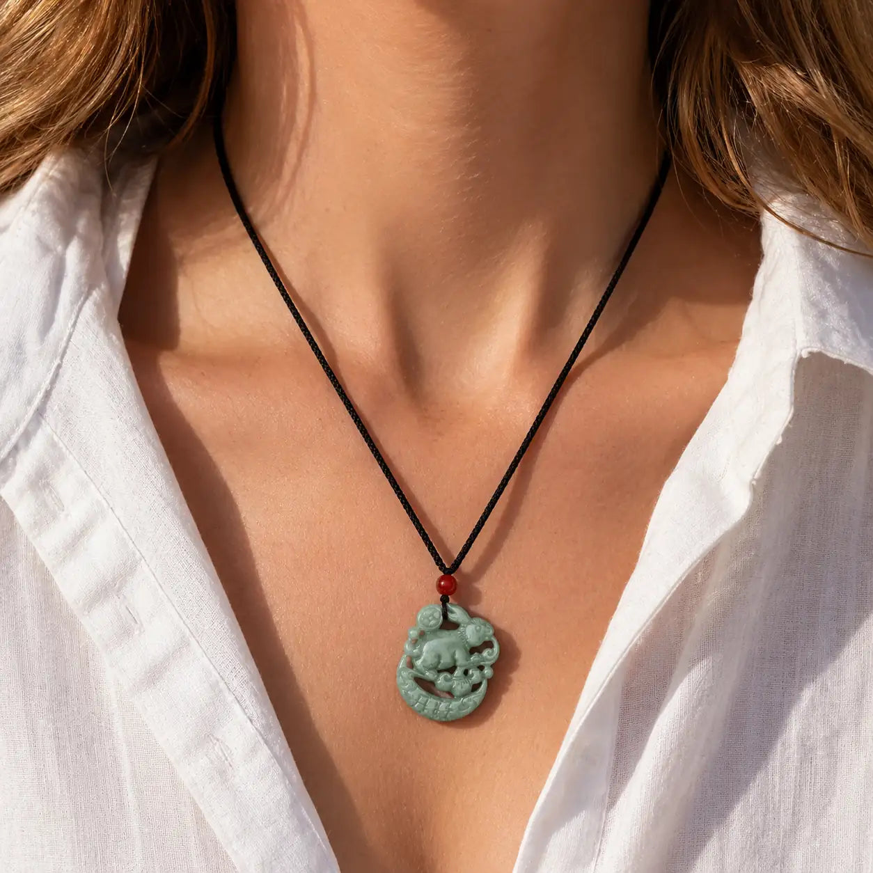 Natural Jade Rabbit Pendant shown from alternate angle with green jade-style carving