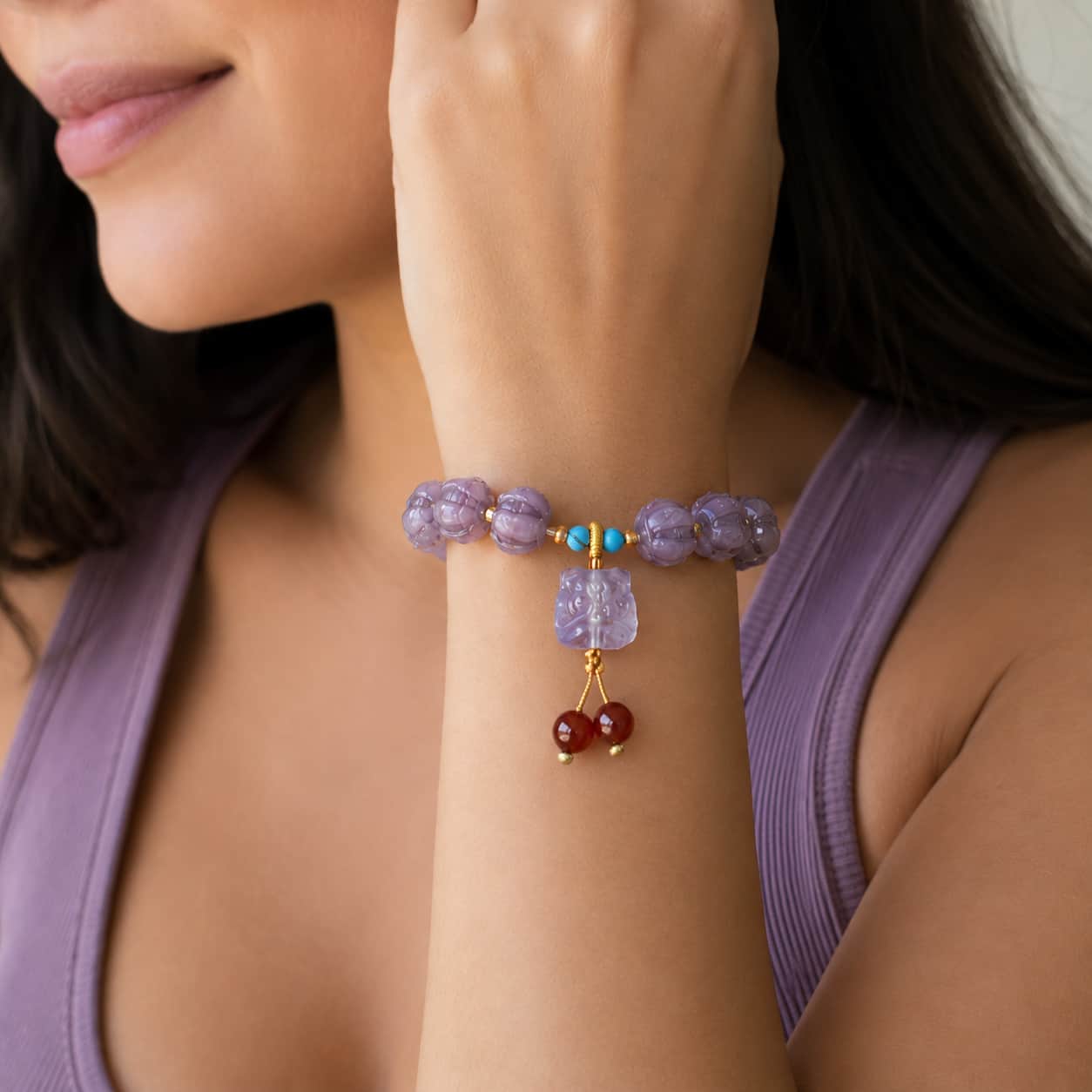 Close-up of Purple Liuli Lotus Bracelet with turquoise and lotus