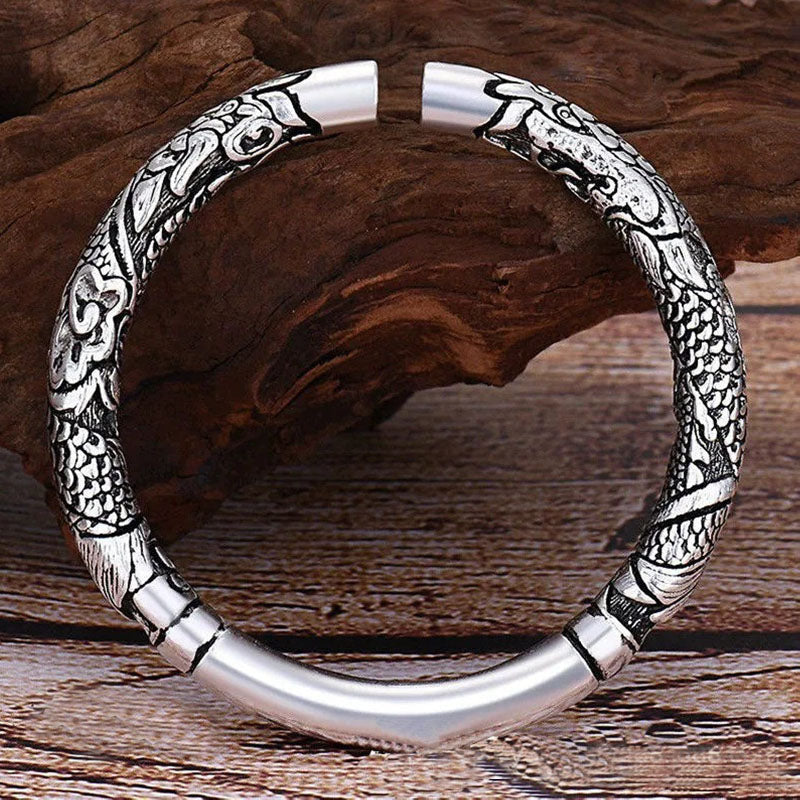 Side detail of Rising Cloud Relief Cuff Bracelet with silver cloud relief pattern