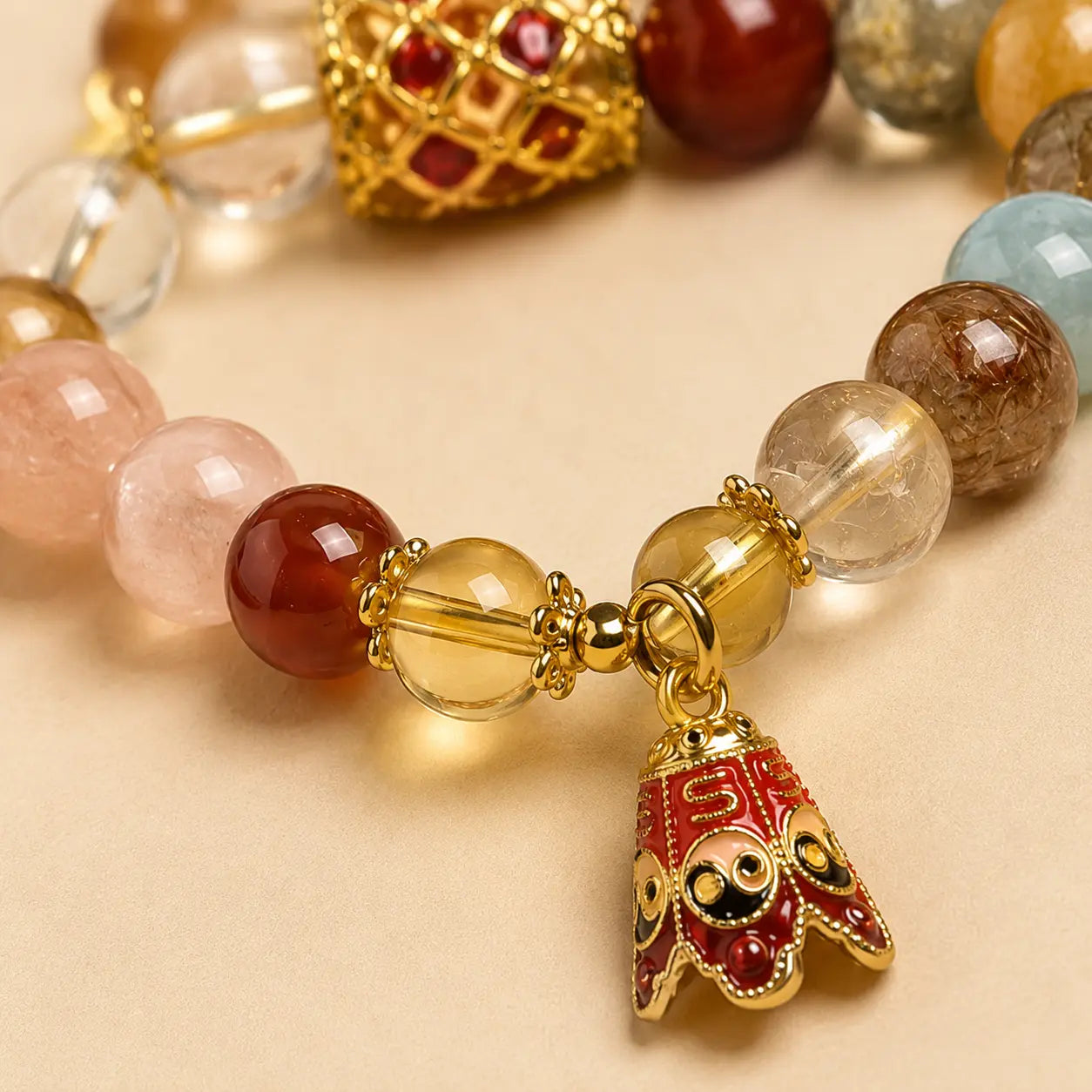 Rutilated Quartz Yin Yang Bracelet shown from another angle with rutilated quartz