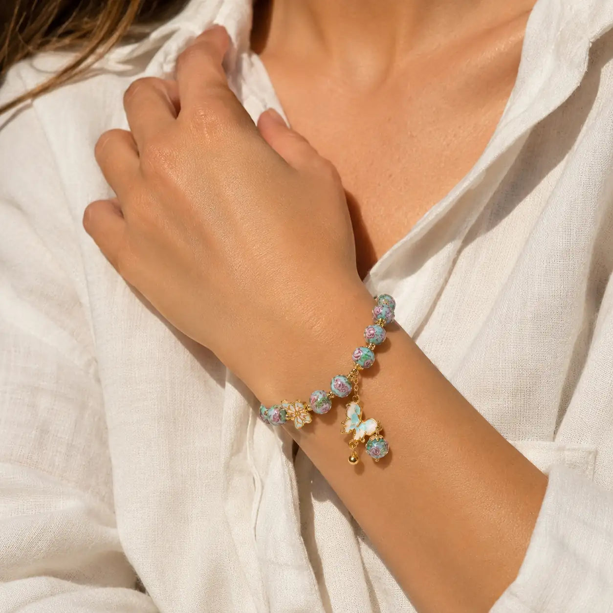 Teal glass butterfly bracelet detail image for gentle transformation by TheFuMaster