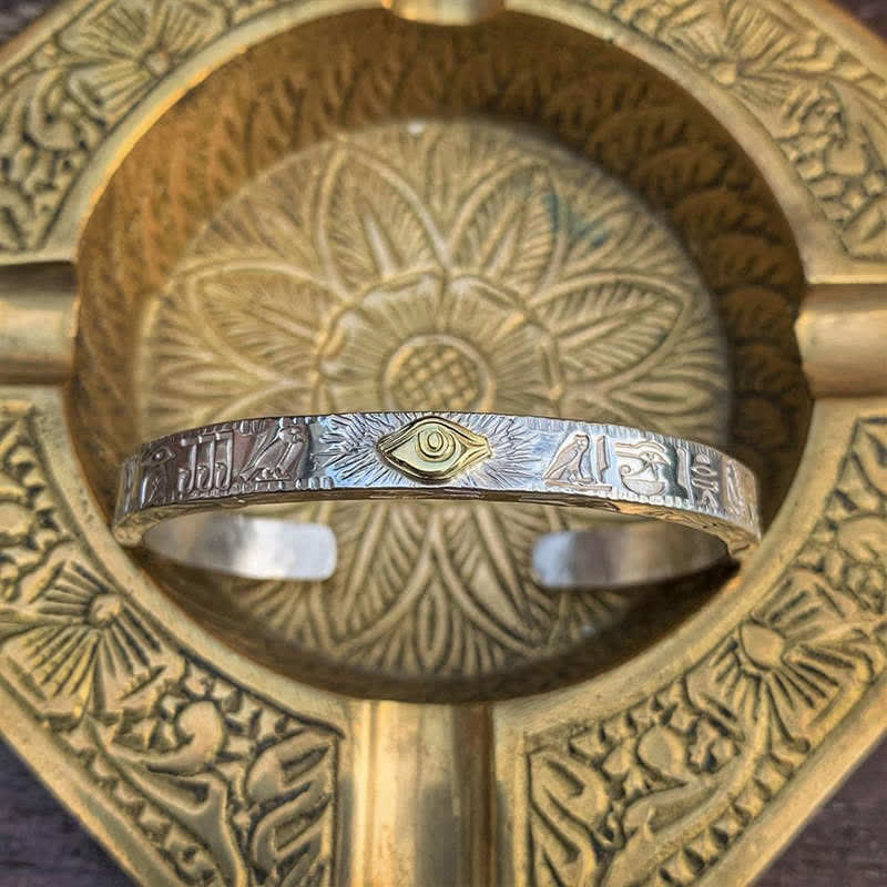 Eye of Horus energy cuff bracelet displayed on Tibetan singing bowl – TheFuMaster