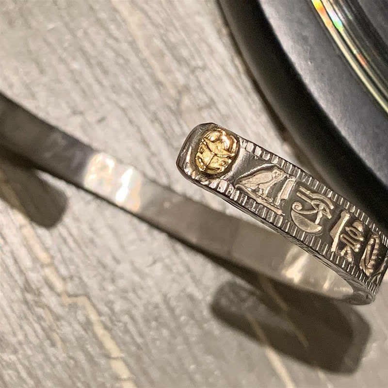 Side detail of Eye of Horus protection cuff showing engraved ancient symbols – TheFuMaster