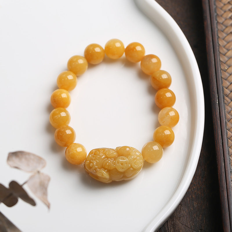 Golden jade PiXiu bracelet styled on ceramic plate – TheFuMaster
