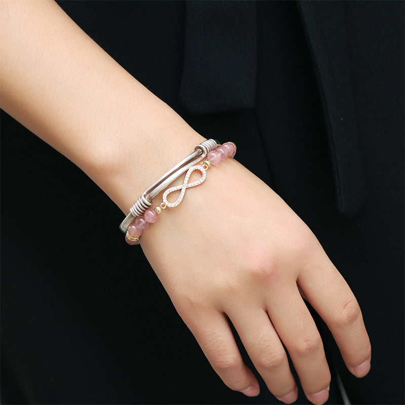 TheFuMaster Strawberry Quartz Infinity Bracelet showcased on hand model – modern minimalist energy jewelry