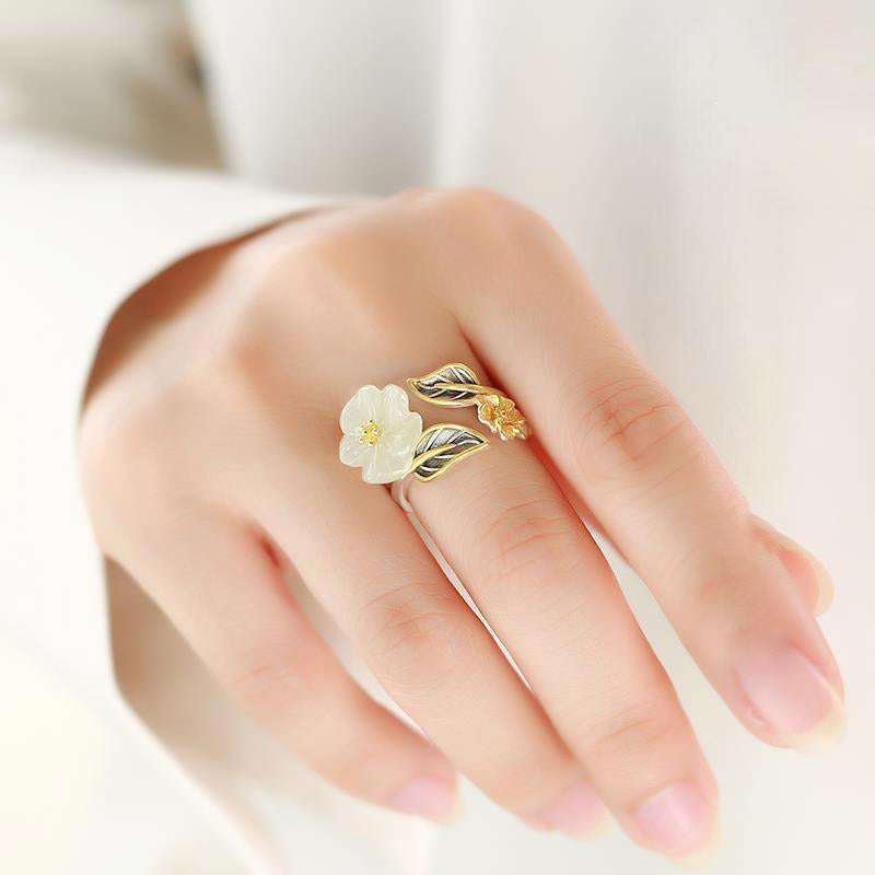 Model wearing the White Jade Plum Flower Leaf Ring, highlighting its delicate and natural style
