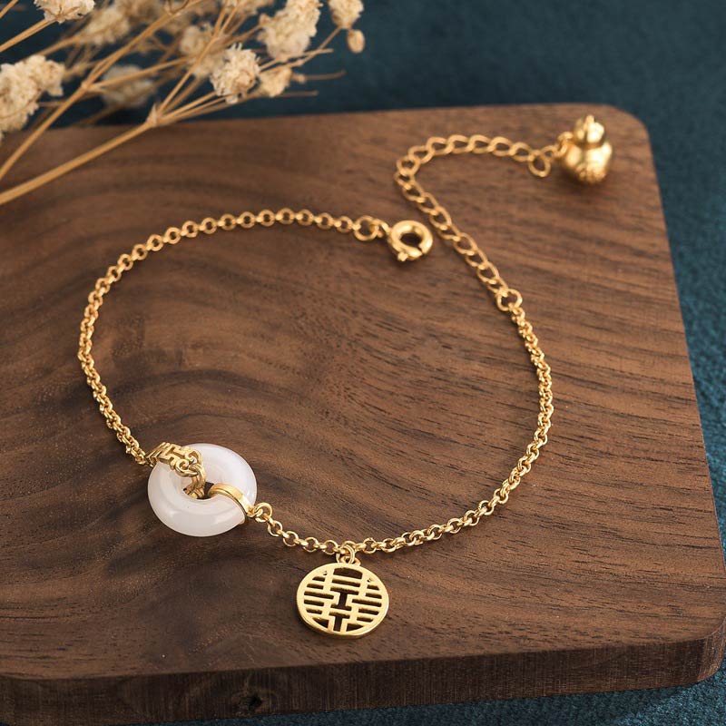White Jade Double Happiness Bracelet by TheFuMaster, gold chain with white jade peace buckle and double happiness charm, symbolizing harmony and fortune.