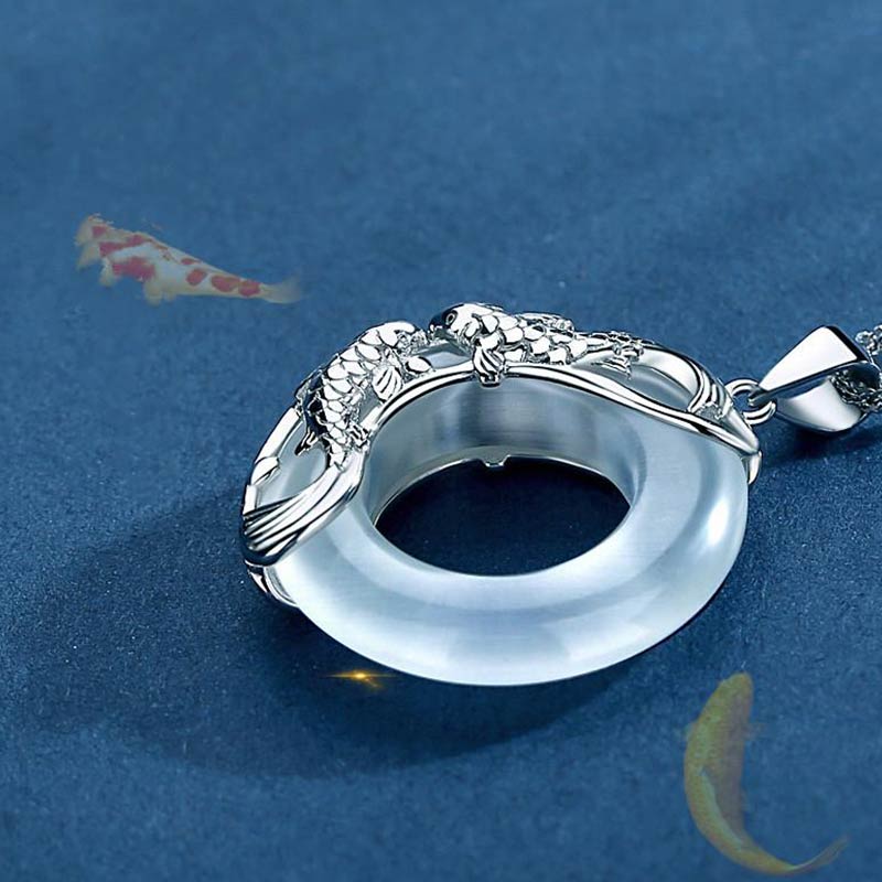 Flatlay display of TheFuMaster White Jade Koi Lucky Necklace for cleansing and balance
