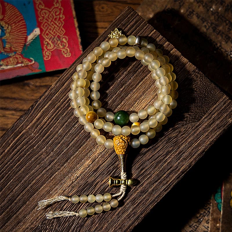 Beaded bracelet with tassel on a wooden surface