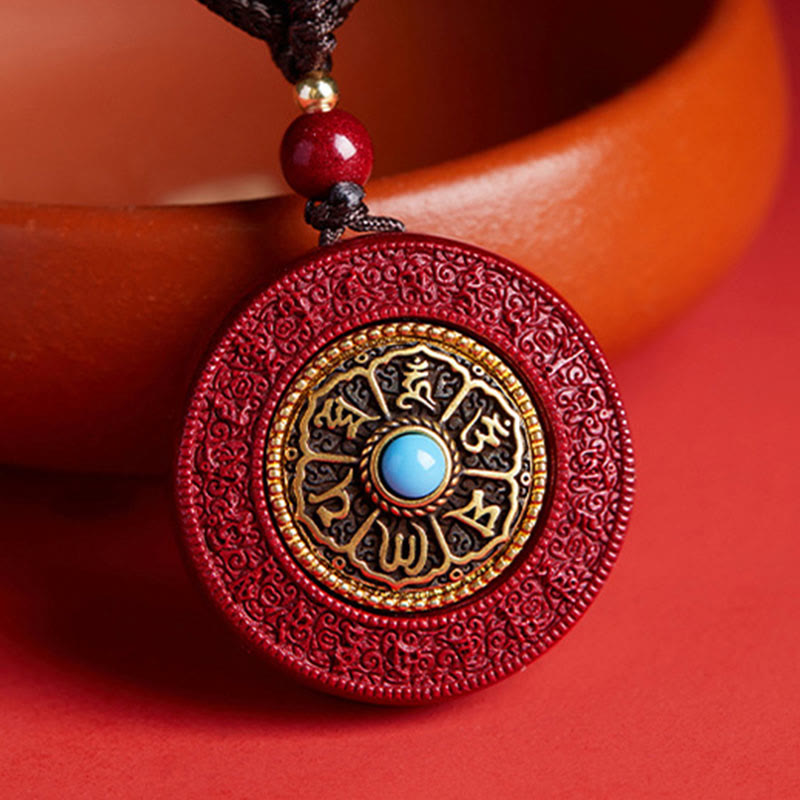 Decorative red pendant with intricate designs and a blue gemstone on a red background
