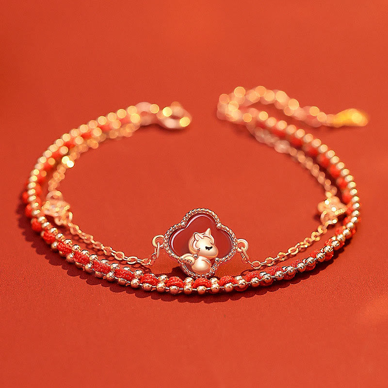 Bracelet with a heart-shaped dog charm on an orange background