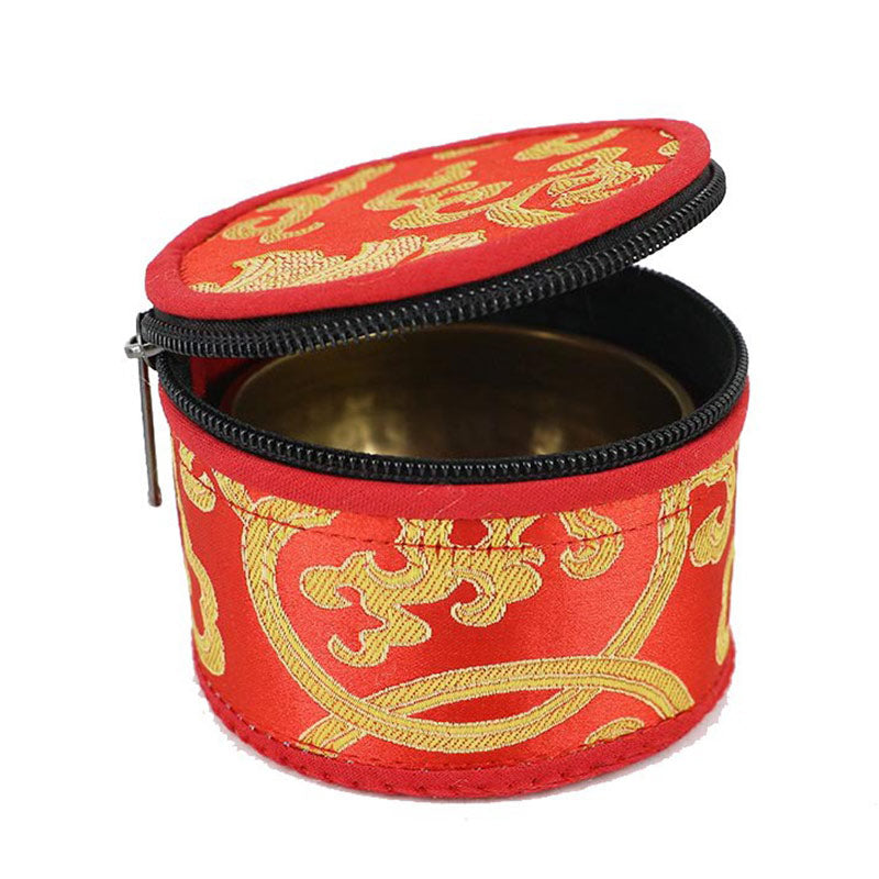 Red and gold embroidered container with a black zipper on a white background