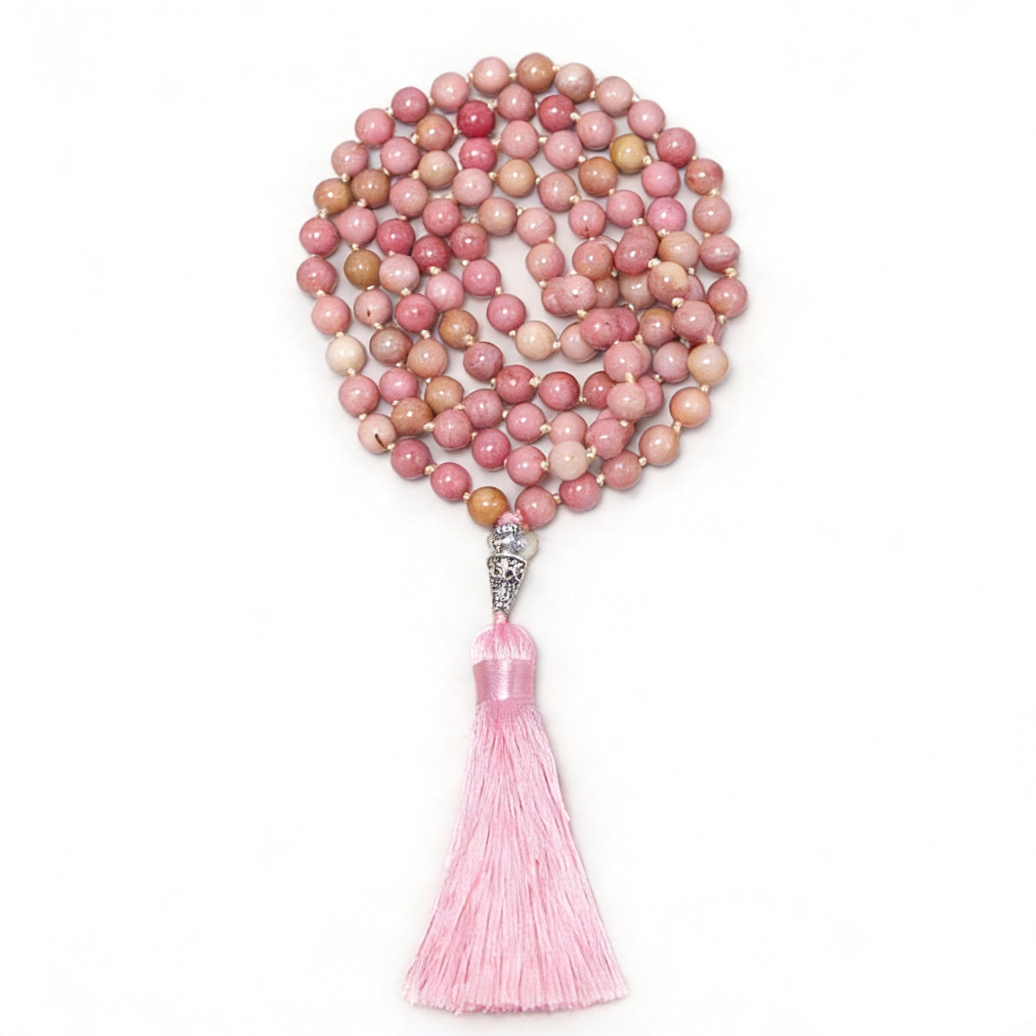Pink beaded necklace with a tassel on a white background