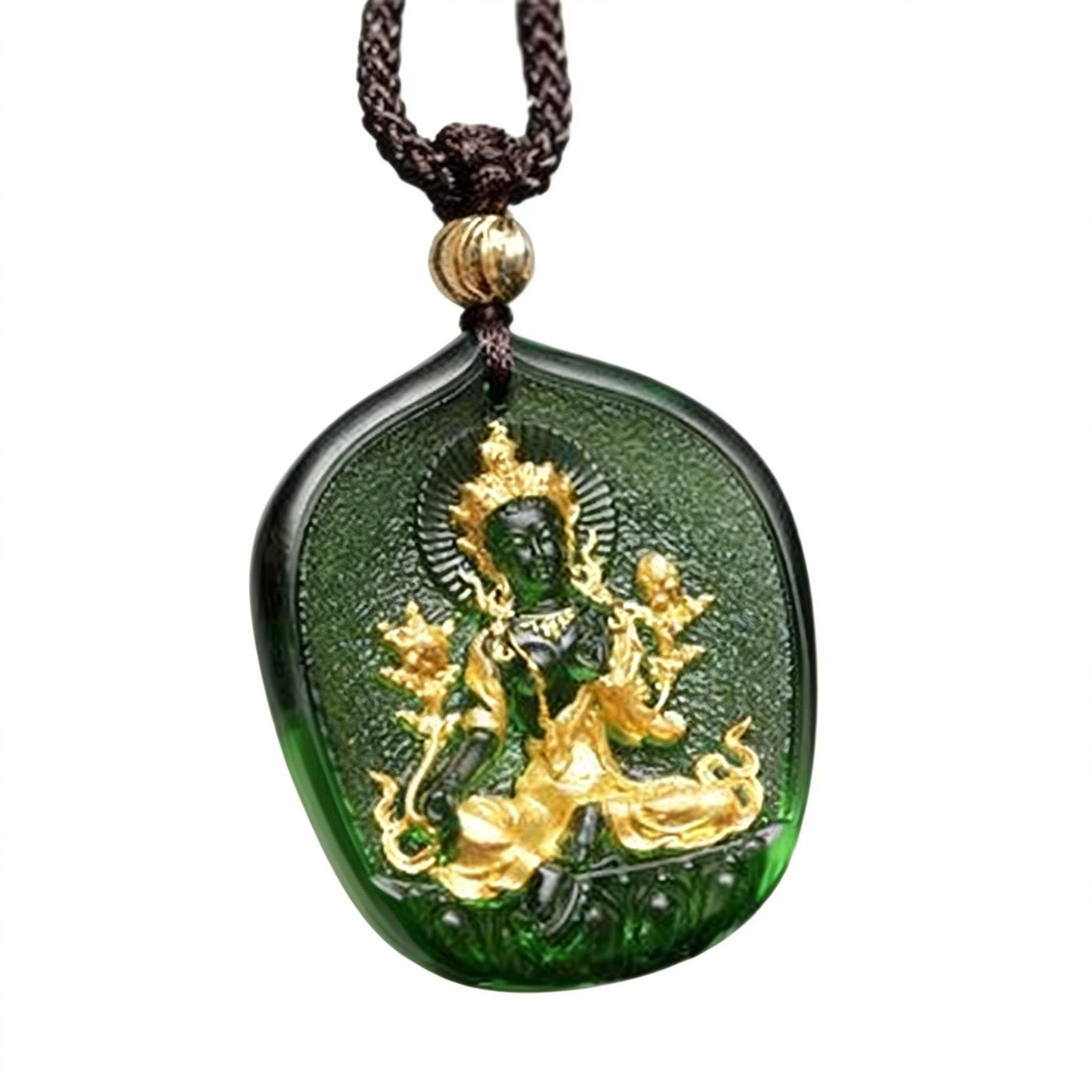 Green pendant with gold figure on a white background