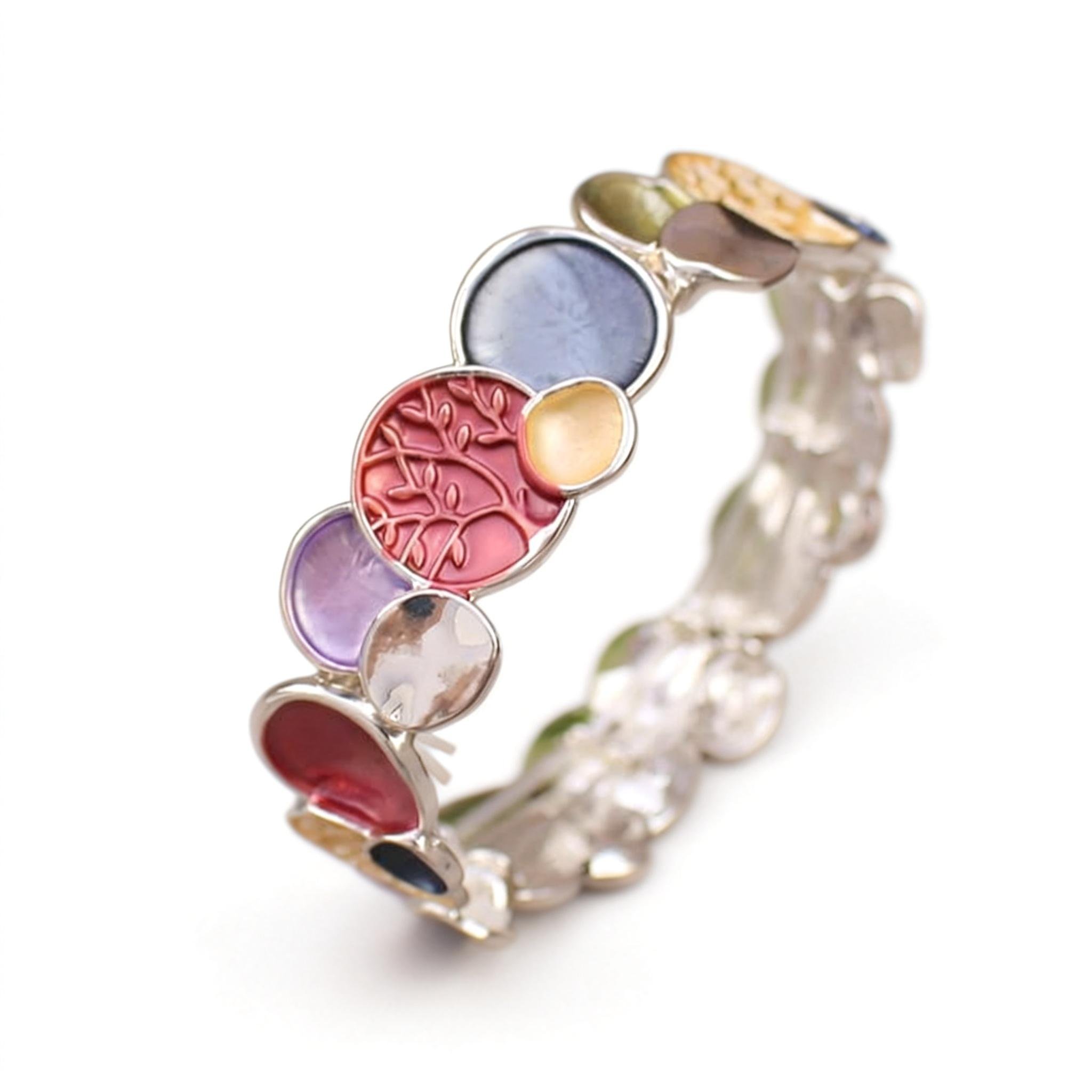 Multicolored ring with floral design on a white background