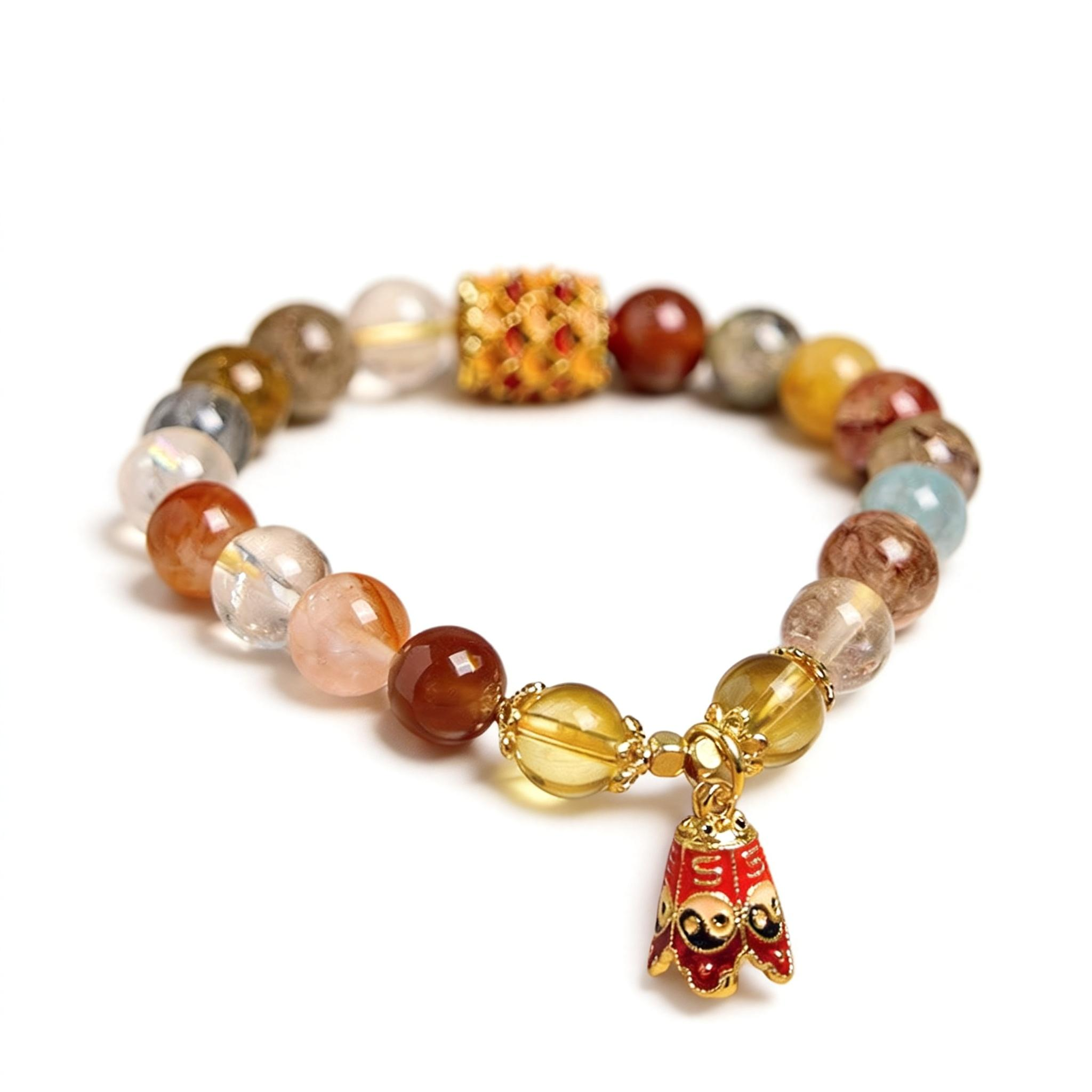 Multicolored beaded bracelet with a gold charm on a white background