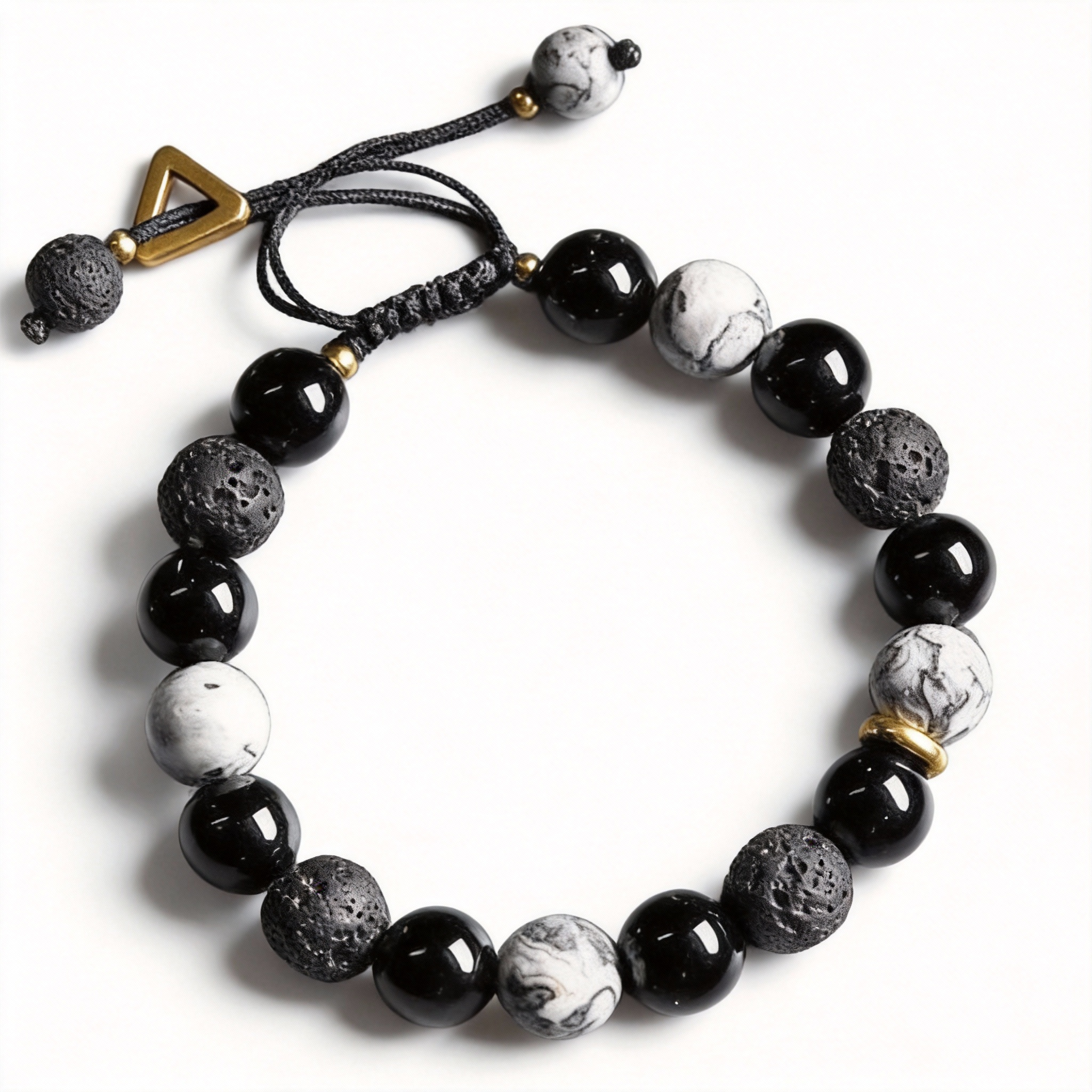 Black and white beaded bracelet with lava rock beads on a white background
