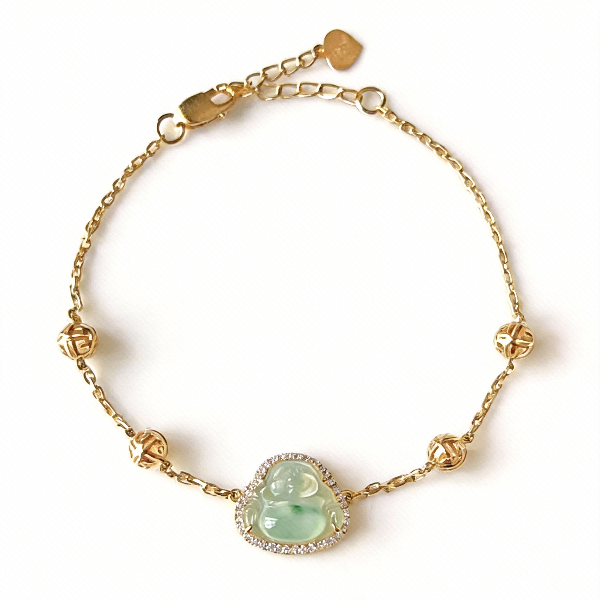 18K gold chain featuring a natural jadeite Buddha pendant, encircled by sparkling diamonds. The Buddha symbolizes peace and joy, paired with exquisite lucky beads. This design blends classic elegance with modern luxury, guarding the wearer's well-being.