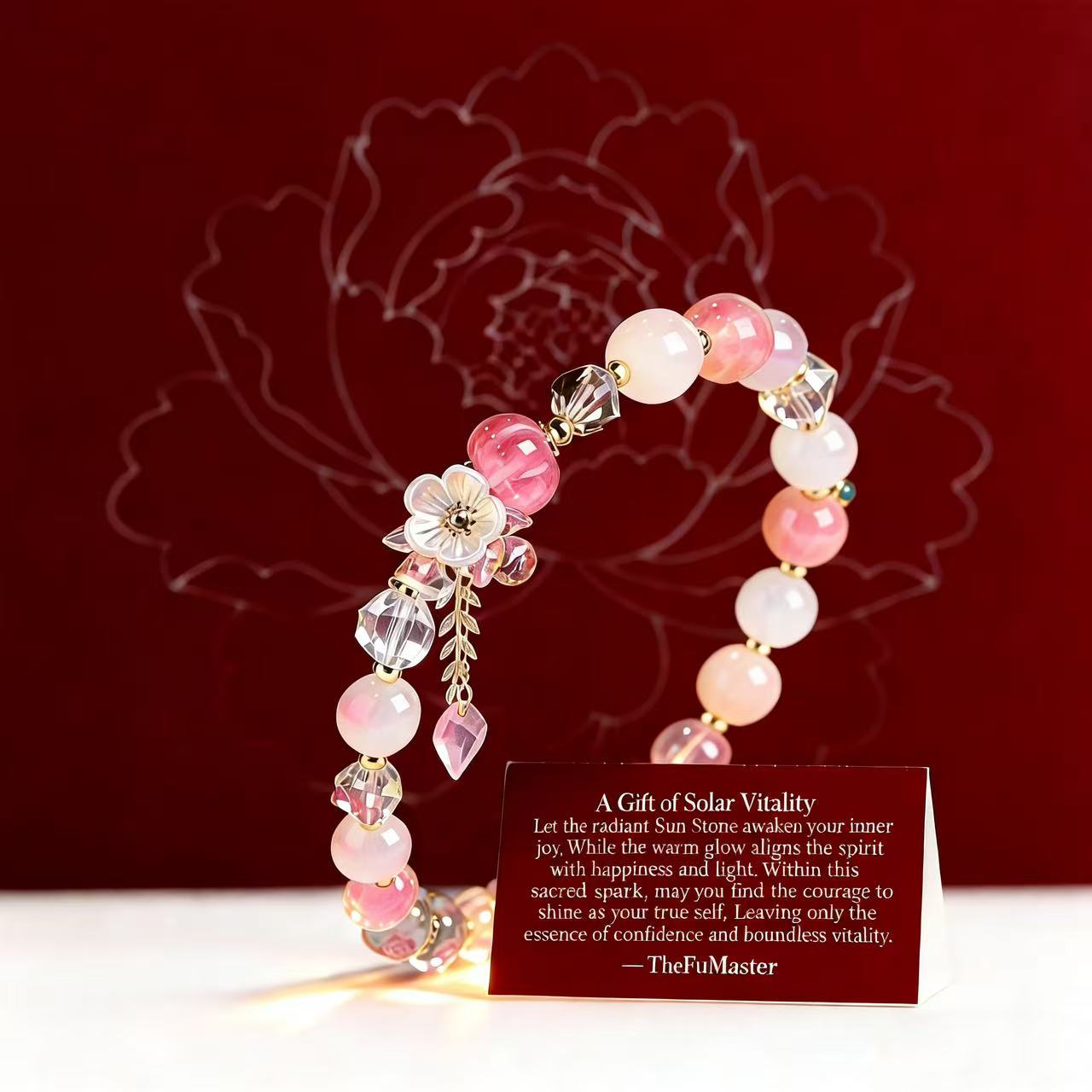 Pink beaded bracelet with floral charm on a red background