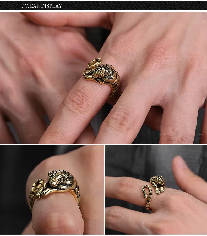 Gold ring with lion design worn on a finger, shown from different angles.