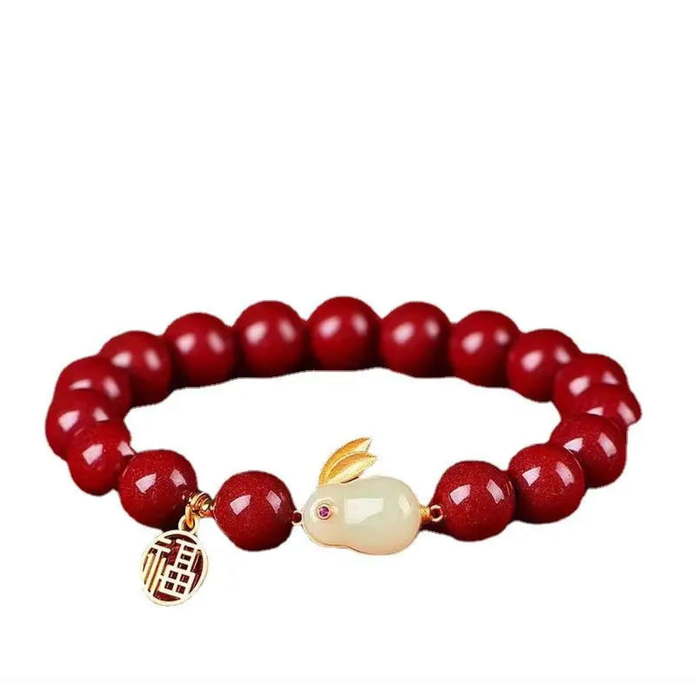 Bracelet with red beads and a bunny charm on a white background