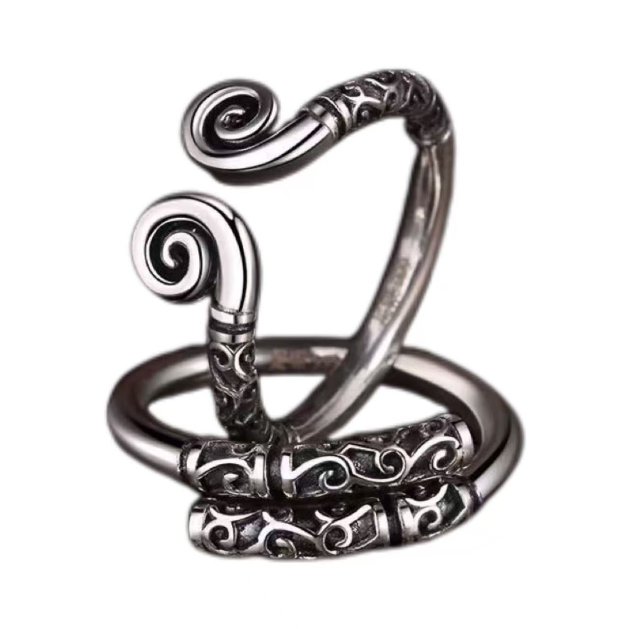 Silver spiral ring on a white background