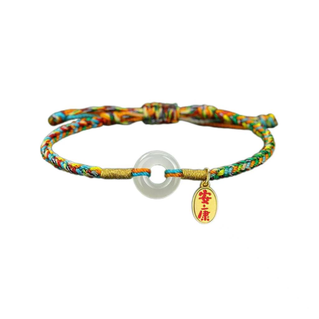 Colorful braided bracelet with a white washer and gold charm on a white background