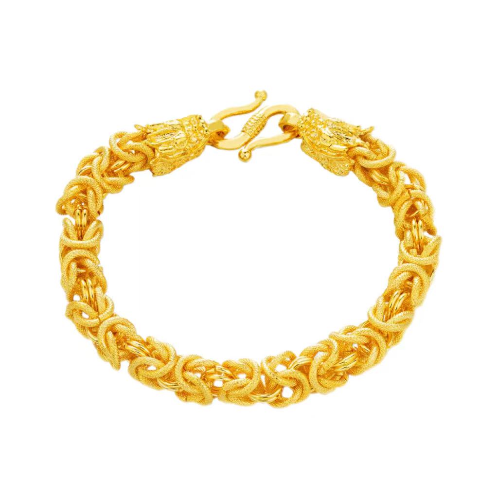 Gold bracelet on a white background