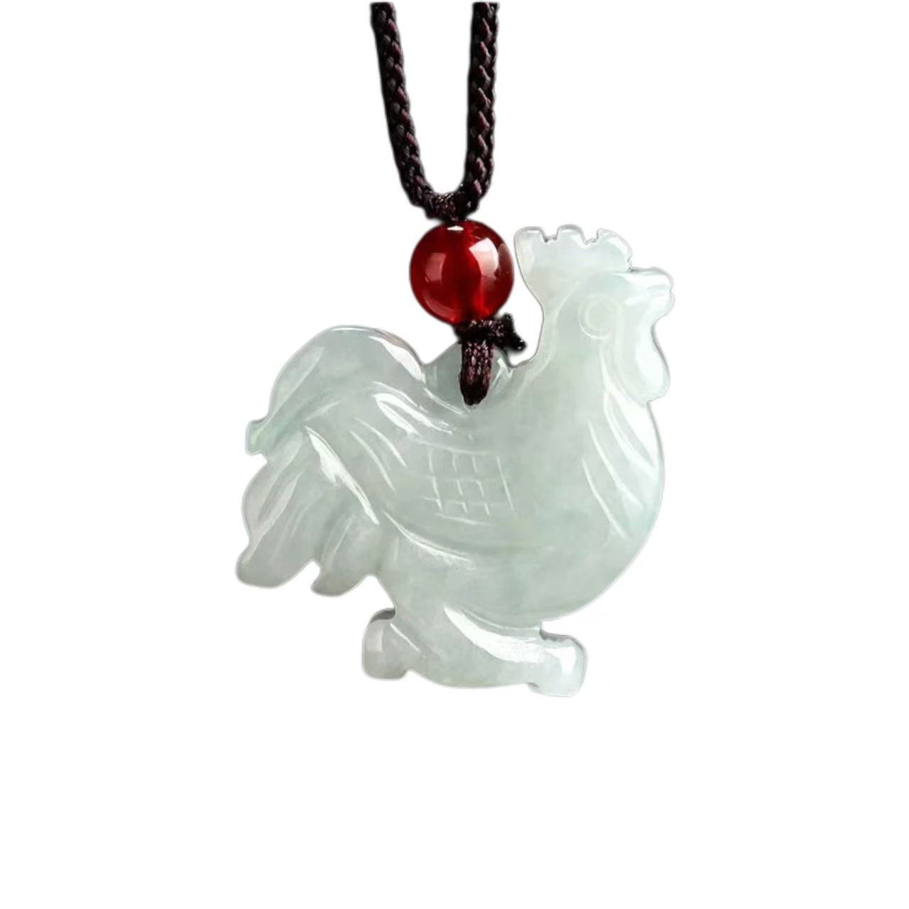 Jade rooster pendant on a red bead cord against a white background