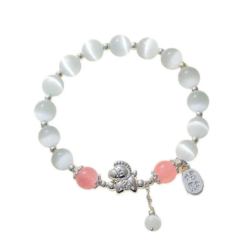 Bracelet with white and pink beads on a white background