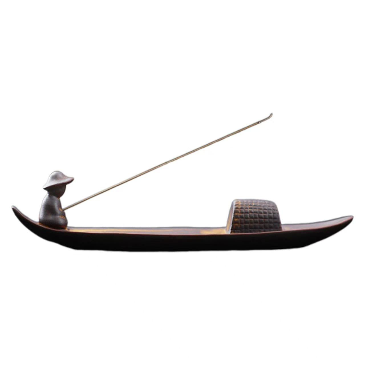 Model of a gondola with a figure and oar on a white background
