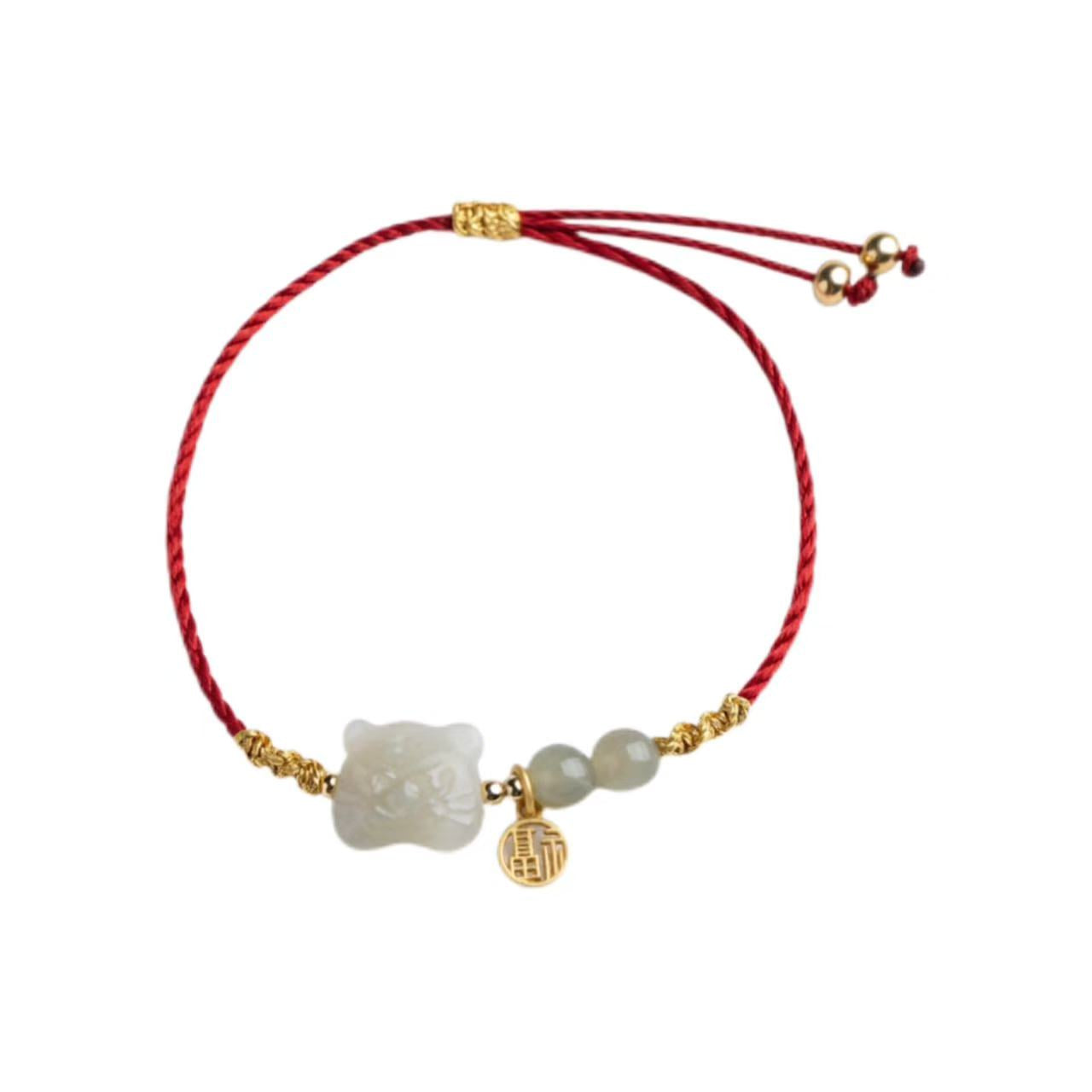 Bracelet with red cord, gold accents, and white beads on a white background