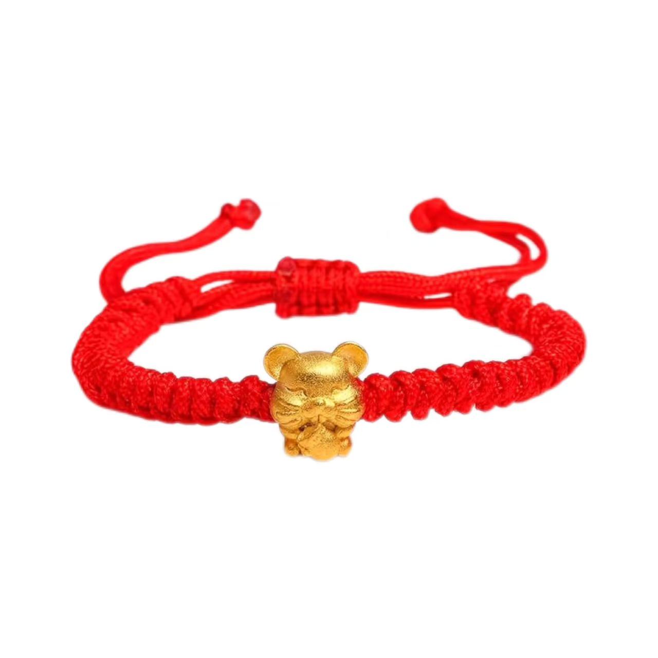 Red bracelet with a gold charm on a white background