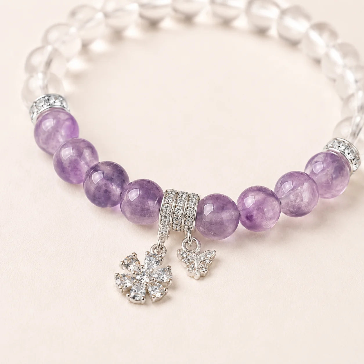 Close-up of Amethyst Zircon Beaded Bracelet with flower and butterfly charms