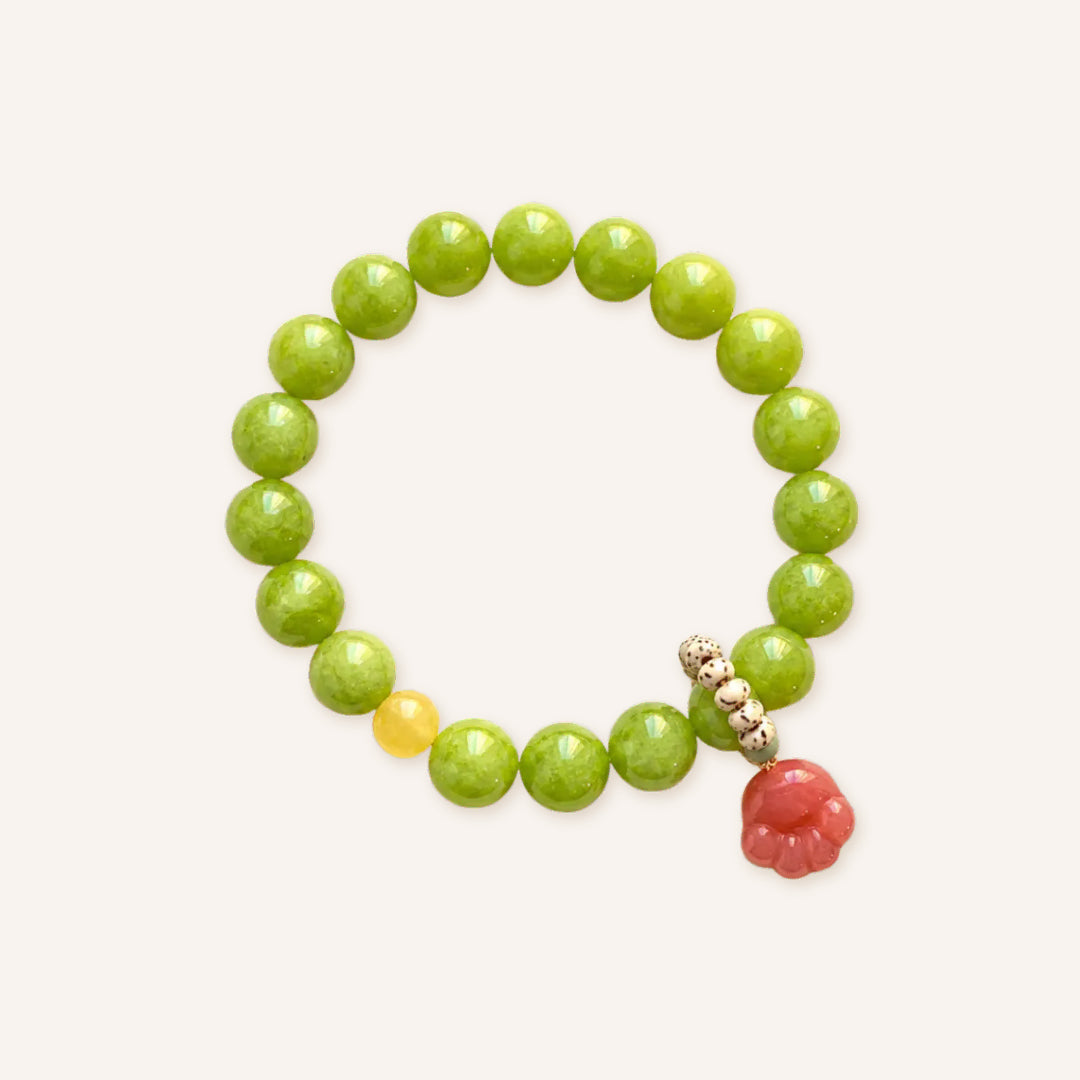 Peach Willow Summer Bracelet featuring vibrant green chalcedony beads, a peach-toned flower charm, and decorative accent beads in a clean product image.