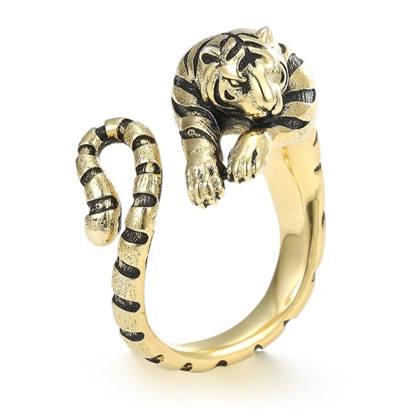 Gold tiger-shaped ring on a white background