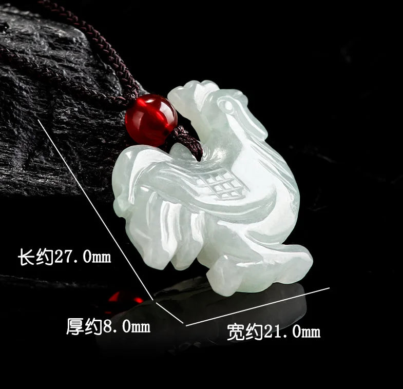 White jade pendant with red gemstone on a dark background