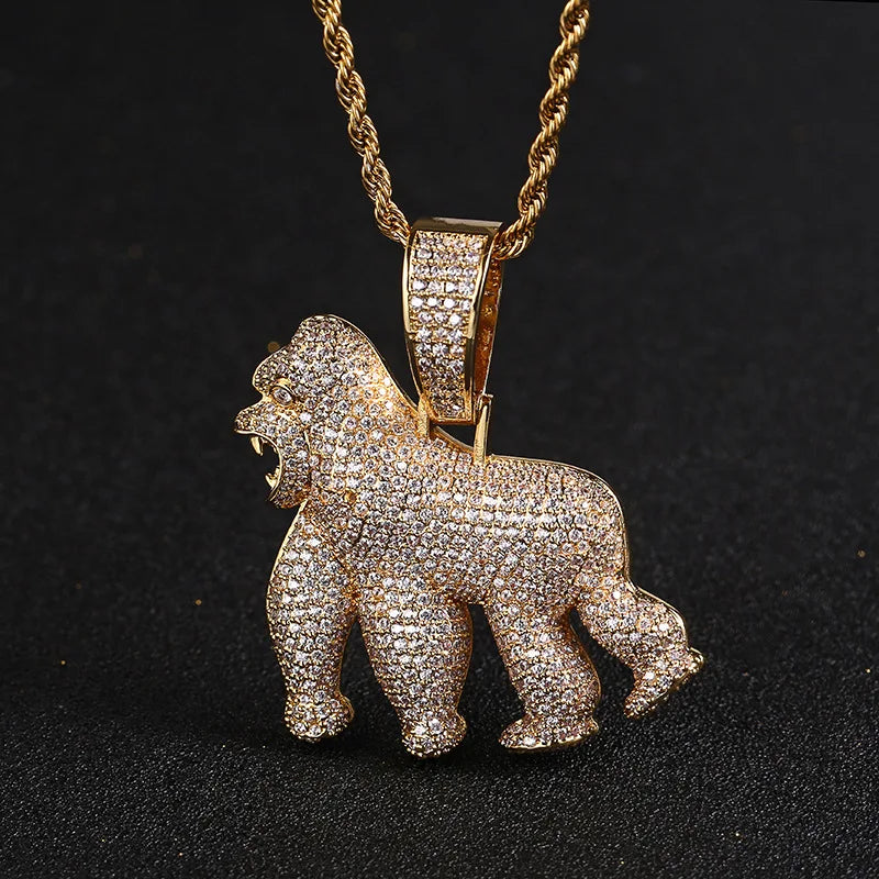 Gold gorilla pendant necklace on a black background