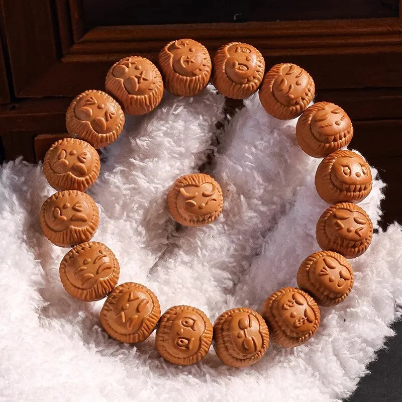Bracelet made of brown textured beads on a white fabric background