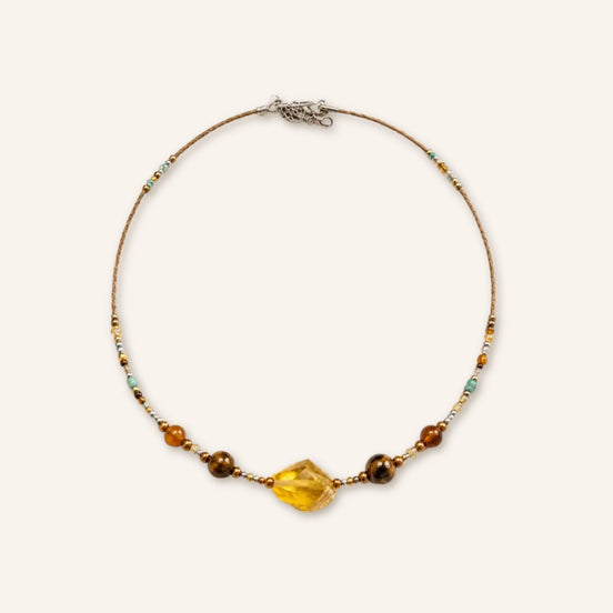 Tear amber beaded necklace by TheFuMaster