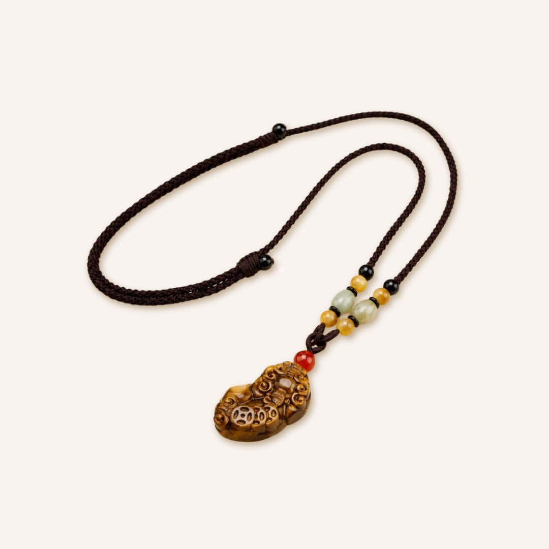 Tiger Eye Pixiu Pendant Necklace featuring a carved tiger eye Pixiu pendant, decorative gemstone accent beads, and an adjustable cord necklace in a clean product image.
