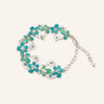 Vintage Green Flower Bracelet featuring silver-tone vine links, turquoise and green enamel flower details, blue crystal accents, and an adjustable chain closure in a clean product image.