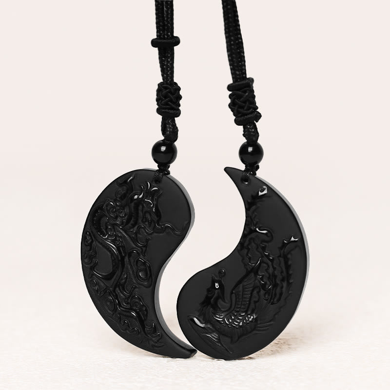 Black and white yin yang pendant on a white background