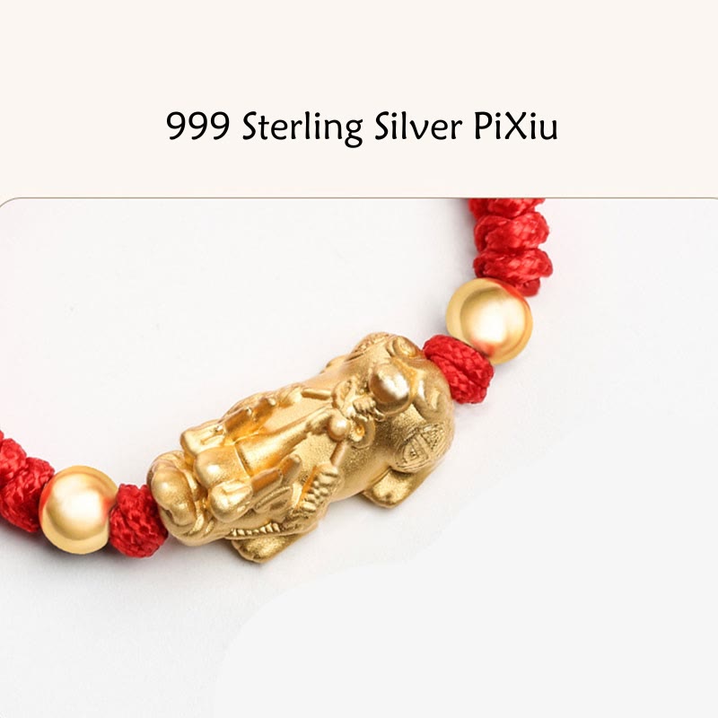 Gold PiXiu charm on a red and gold bracelet with '999 Sterling Silver PiXiu' text.