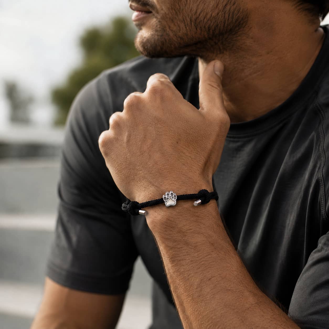 Close-up of Black Cord Dog Paw Bracelet