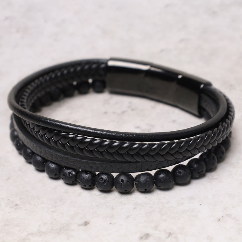 Top view of TheFuMaster black lava rock leather bracelet with braided details

