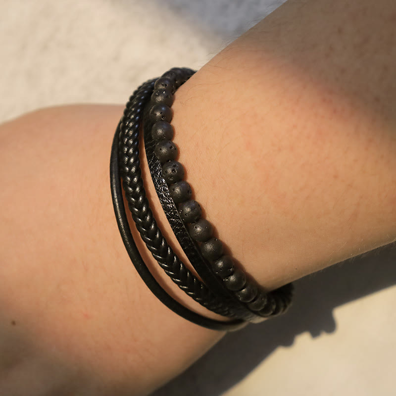 TheFuMaster black leather and lava rock bracelet worn on wrist, minimalist look
